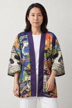 Skull and Peacock Kimono Jacket 'Mujo' – women's kimono jacket with colourful skull, peacock feather and flower print, Japanese haori style cardigan, front view on model