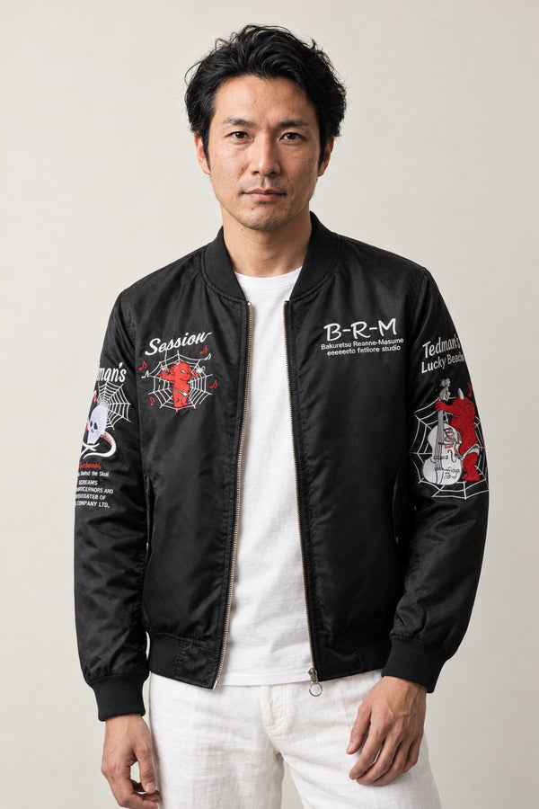 Skull and Serpent Bomber Jacket 'Dokuja' – black bomber jacket with embroidered skull, serpent and lettering patches, Japanese streetwear, front view on model
