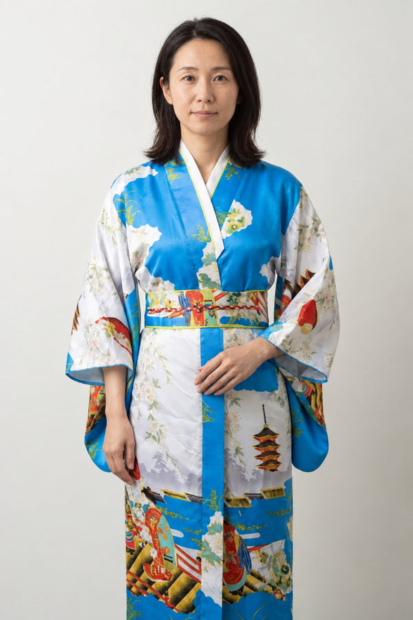 Sky Blue Pagoda Kimono Robe 'Gojunoto' – sky blue women's kimono robe with pagoda, peacock and floral print and red obi, long Japanese satin-look kimono, front view on model