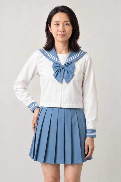 Sky Blue Sailor Fuku Set 'Sorairo' – white long sleeve sailor top with sky blue collar and bow and sky blue pleated skirt, Japanese school uniform seifuku set, sailor top and pleated skirt, front view on model