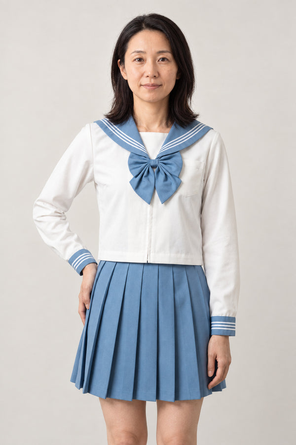 Sky Blue Sailor Fuku Set 'Sorairo' – white long sleeve sailor top with sky blue collar and bow and sky blue pleated skirt, Japanese school uniform seifuku set, sailor top and pleated skirt, front view on model