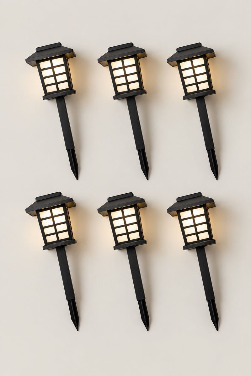 Solar Japanese Garden Lanterns 'Michiakari' – set of six solar Japanese garden path lanterns on stakes, lit, studio view