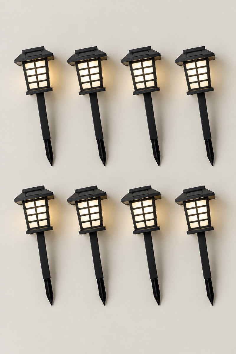 Solar Japanese Garden Lanterns 'Michiakari' – set of eight solar Japanese garden path lanterns on stakes, lit, studio view