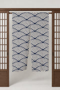 Speckled Seigaiha Noren Curtain 'Tenten' – cream noren with seigaiha wave pattern in navy dots, split Japanese noren door curtain hung on a rod between sliding screens, studio view
