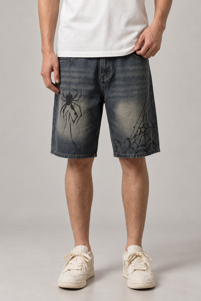 Spider Web Print Denim Shorts 'Kumonosu' – dark washed denim shorts with spider web and spider print, Japanese streetwear shorts, front view on model