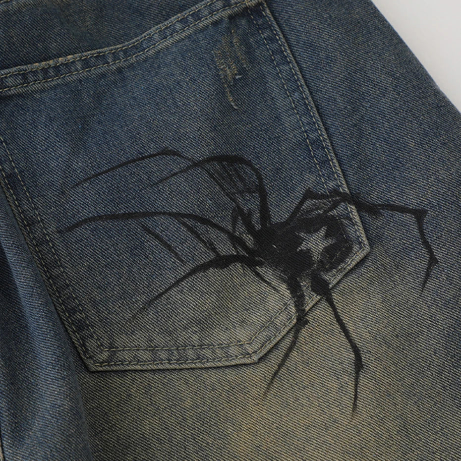 Spider Web Print Denim Shorts 'Kumonosu' – close-up detail of the printed spider on the pocket