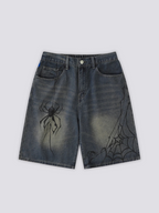 Spider Web Print Denim Shorts 'Kumonosu' – flat lay front view of the dark washed denim shorts