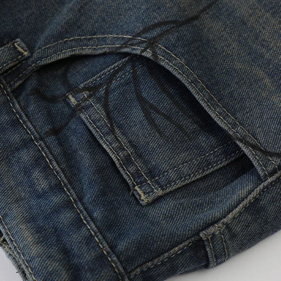 Spider Web Print Denim Shorts 'Kumonosu' – close-up detail of the dark washed denim rear pocket