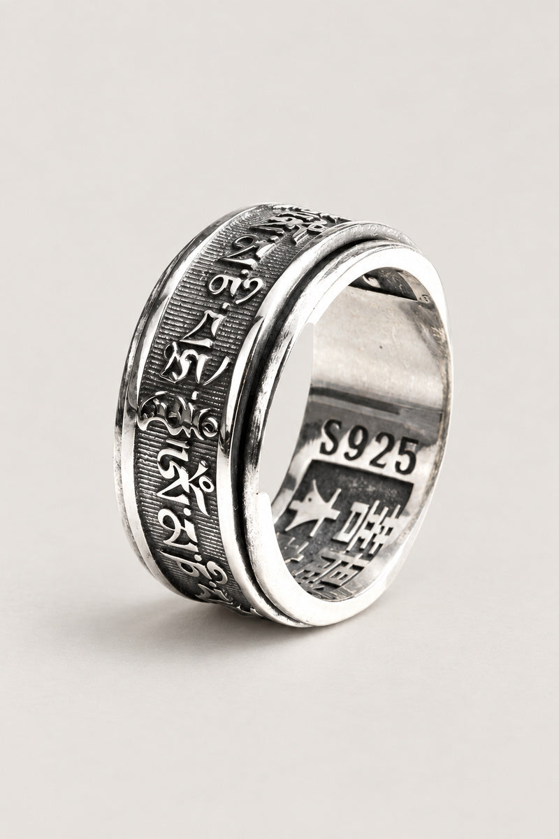 Spinning Mantra Ring 'Nenju' – sterling silver spinner ring with Sanskrit mantra engraved on the rotating outer band, Japanese meditation ring, studio view