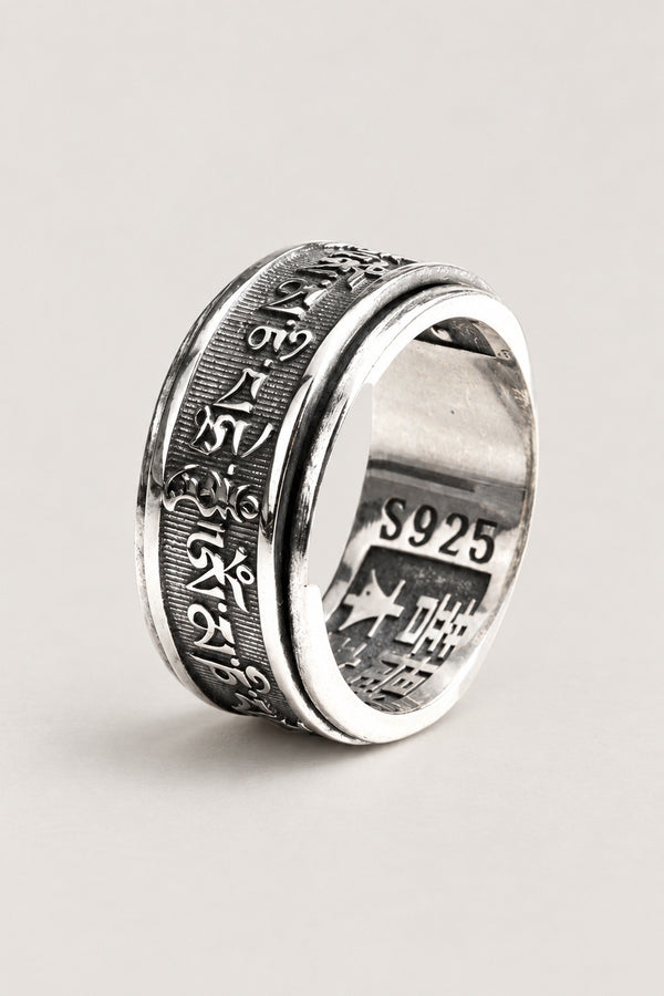 Spinning Mantra Ring 'Nenju' – sterling silver spinner ring with Sanskrit mantra engraved on the rotating outer band, Japanese meditation ring, studio view