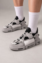 Strapped Utility Chunky Sneakers 'Yoroi' – grey and black version of the strapped chunky sneakers, Japanese streetwear sneakers worn with white socks, on model