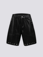 Studded Faux Leather Shorts 'Byo' – flat lay front view of the black studded faux leather shorts