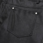 Studded Faux Leather Shorts 'Byo' – close-up detail of the rear pocket with stud