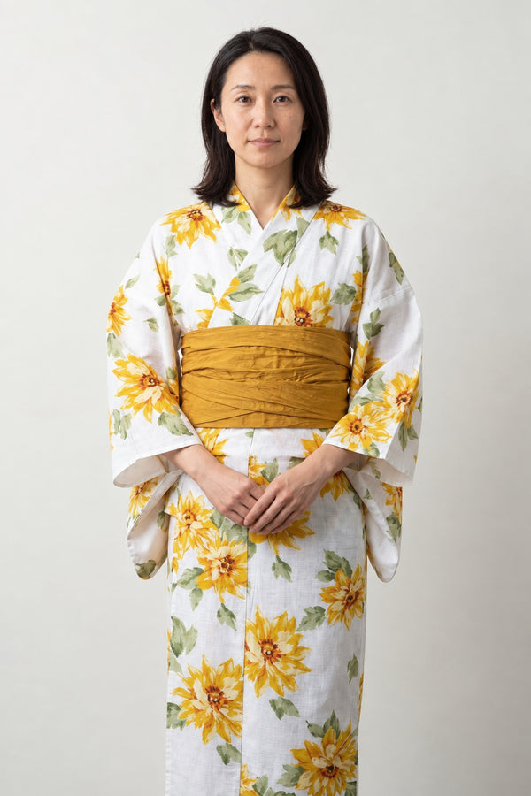 Sunflower Summer Yukata 'Natsubi' – white women's summer yukata with yellow sunflower print and mustard obi belt, traditional Japanese kimono, front view on model