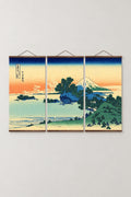 Sunset Coast Fuji Triptych 'Yuhi' – Shichirigahama in Sagami Province, pine coast at sunset with Fuji from Hokusai's Thirty-six Views of Mount Fuji, three-panel triptych on wooden hanging rails, Japanese wall art, studio view