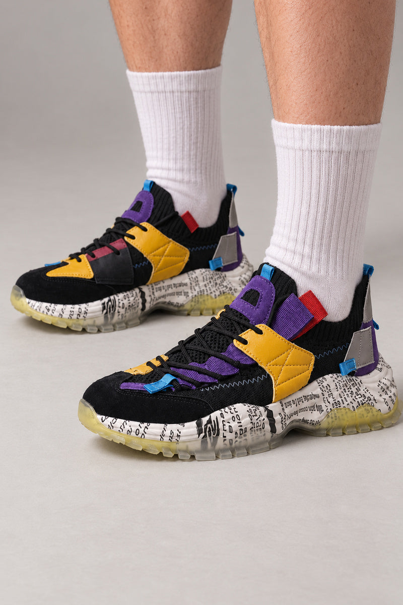 Text Print Sole Sneakers 'Sumiji' – black version with purple and yellow accents and text print sole, Japanese streetwear sneakers worn with white socks, on model