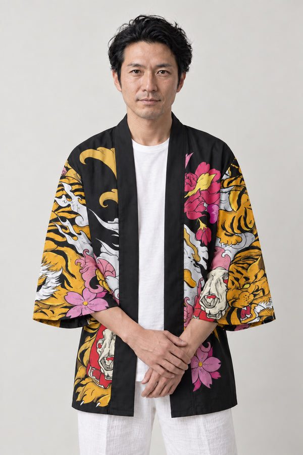 Tiger Blossom Festival Jacket 'Harutora' – black happi festival jacket with yellow tiger and pink blossom print, Japanese happi coat, unisex festival jacket, front view on model