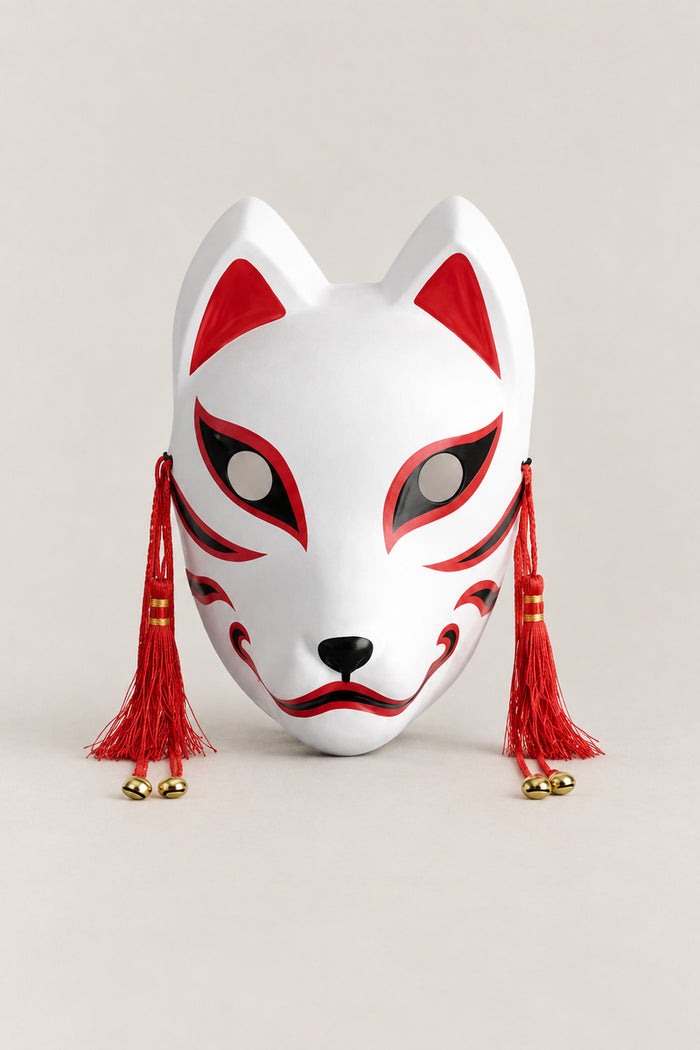 Traditional Fox Mask 'Shiragitsune' – white kitsune fox mask with red ears, red eye sweeps, red tassels and brass bells, classic, Japanese kitsune festival mask, studio view
