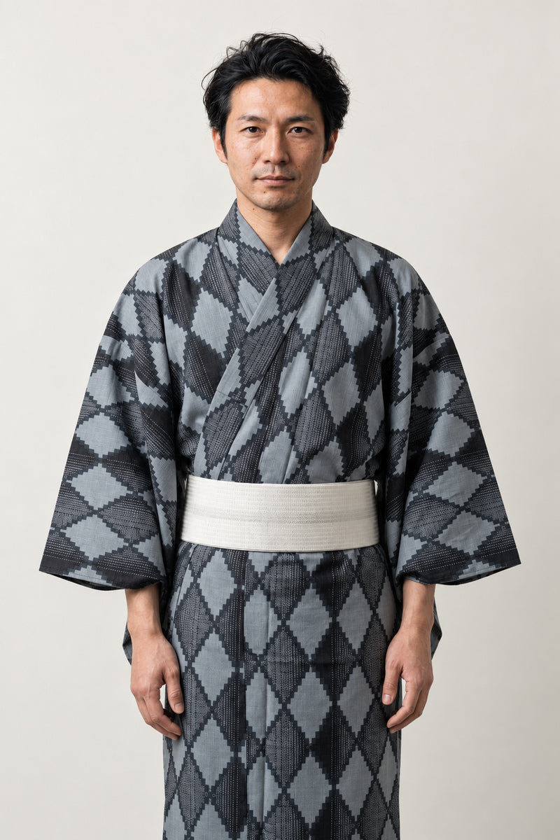 Traditional Japanese Kimono 'Hishimon' – grey and black diamond pattern men's kimono with cream obi belt, traditional Japanese yukata robe, front view on model
