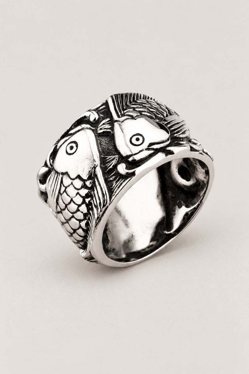 Twin Koi Ring 'Futagoi' – wide stainless steel ring with two koi carp curling round each other in high relief, Japanese koi fish ring, studio view