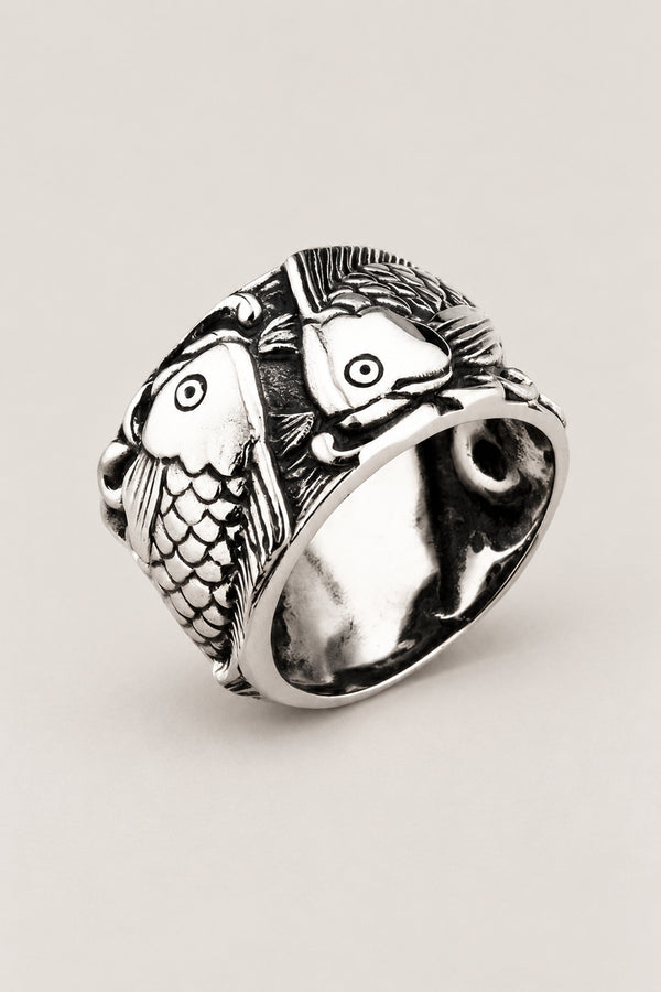 Twin Koi Ring 'Futagoi' – wide stainless steel ring with two koi carp curling round each other in high relief, Japanese koi fish ring, studio view
