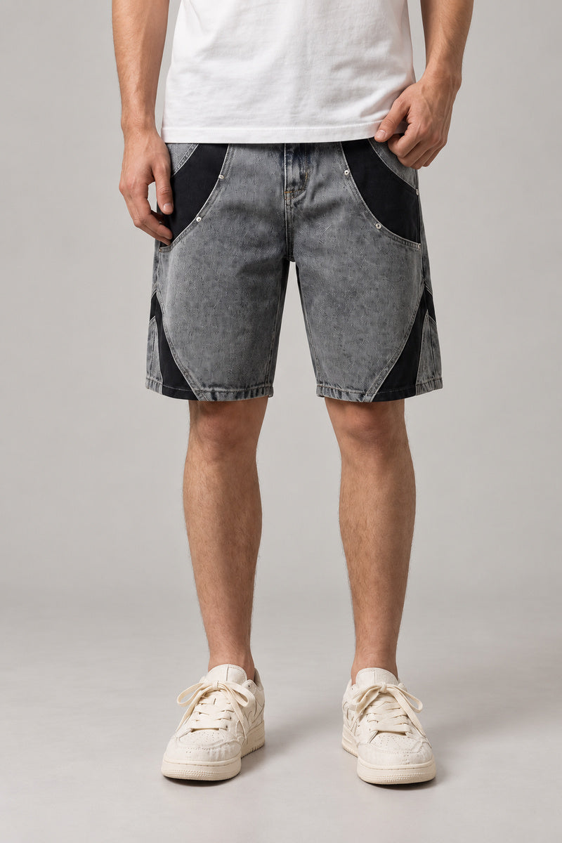 Two Tone Panelled Denim Shorts 'Hagi' – grey two tone panelled denim shorts with black inserts and studs, Japanese streetwear shorts, front view on model