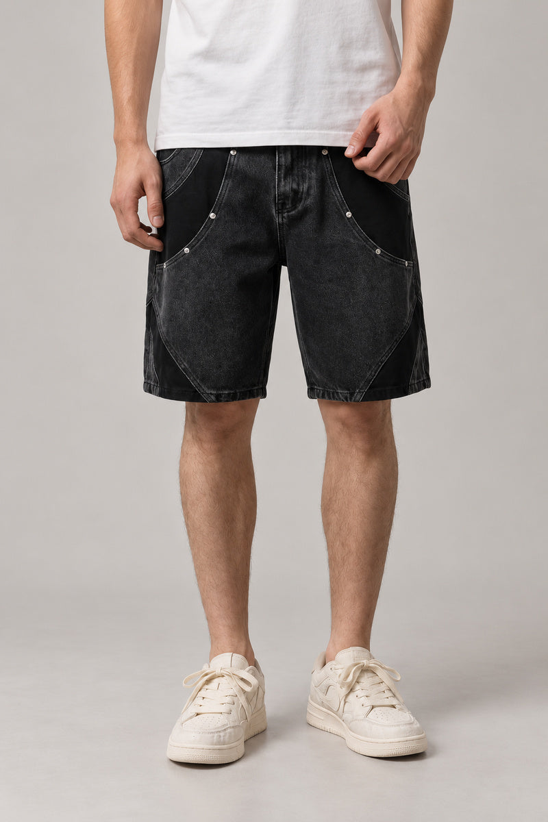 Two Tone Panelled Denim Shorts 'Hagi' – black version of the two tone panelled denim shorts, front view on model