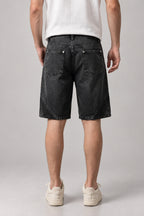Two Tone Panelled Denim Shorts 'Hagi' – back view of the black two tone panelled denim shorts on model