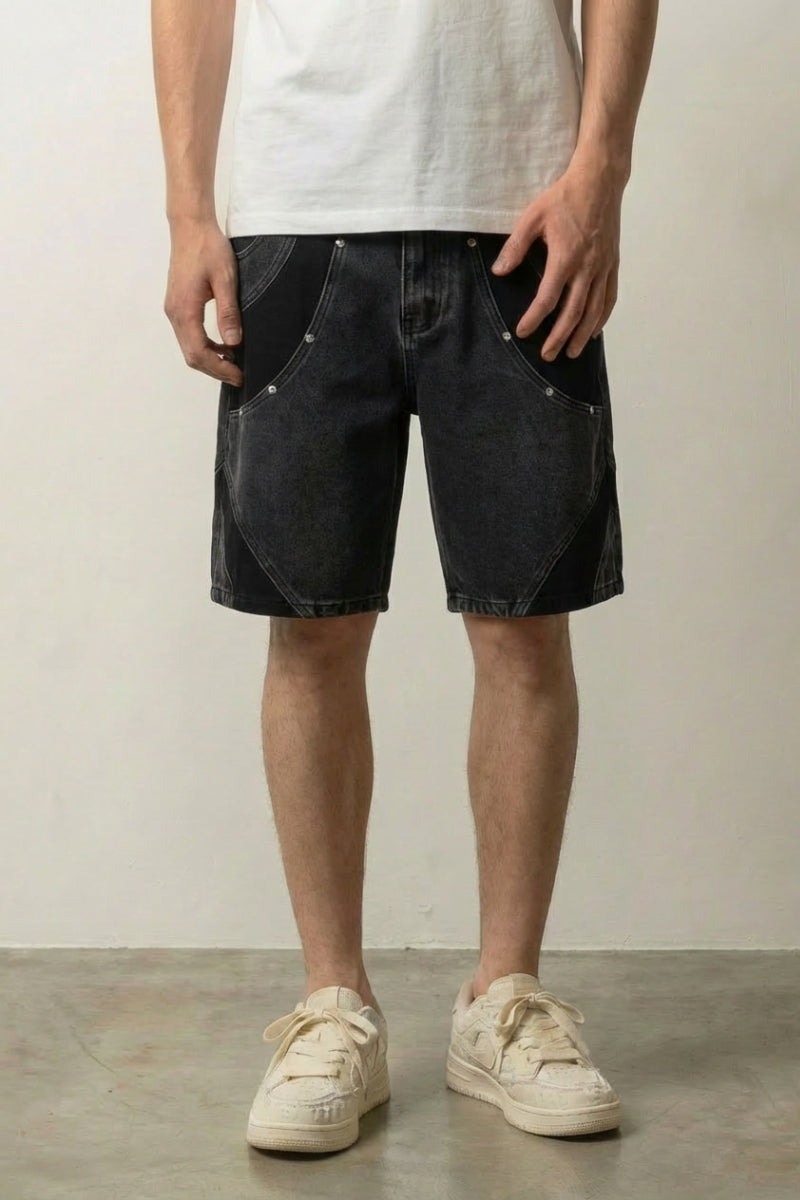 Two Tone Panelled Denim Shorts 'Hagi' – black two tone panelled denim shorts, front view on model, studio