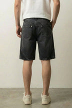 Two Tone Panelled Denim Shorts 'Hagi' – black two tone panelled denim shorts, back view on model, studio