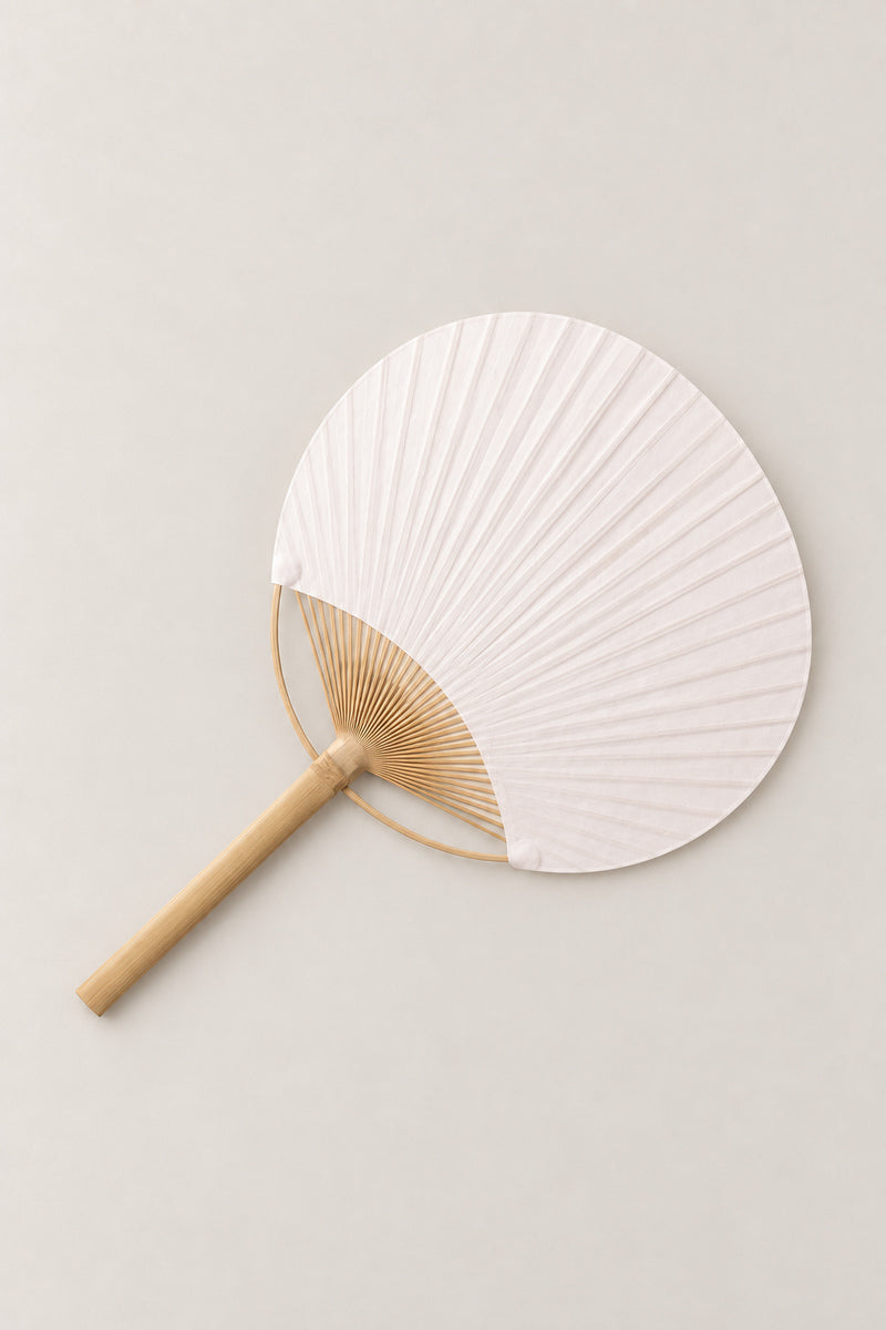 Uchiwa Fan 'Shiraha' – plain white pleated paper uchiwa fan on a bamboo handle, flat round Japanese hand fan, studio view