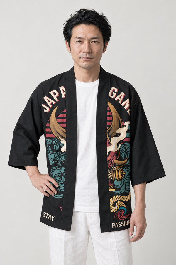 Varsity Oni Happi Jacket 'Bancho' – black varsity style happi jacket with red oni mask and lettering print, Japanese happi coat, unisex festival jacket, front view on model