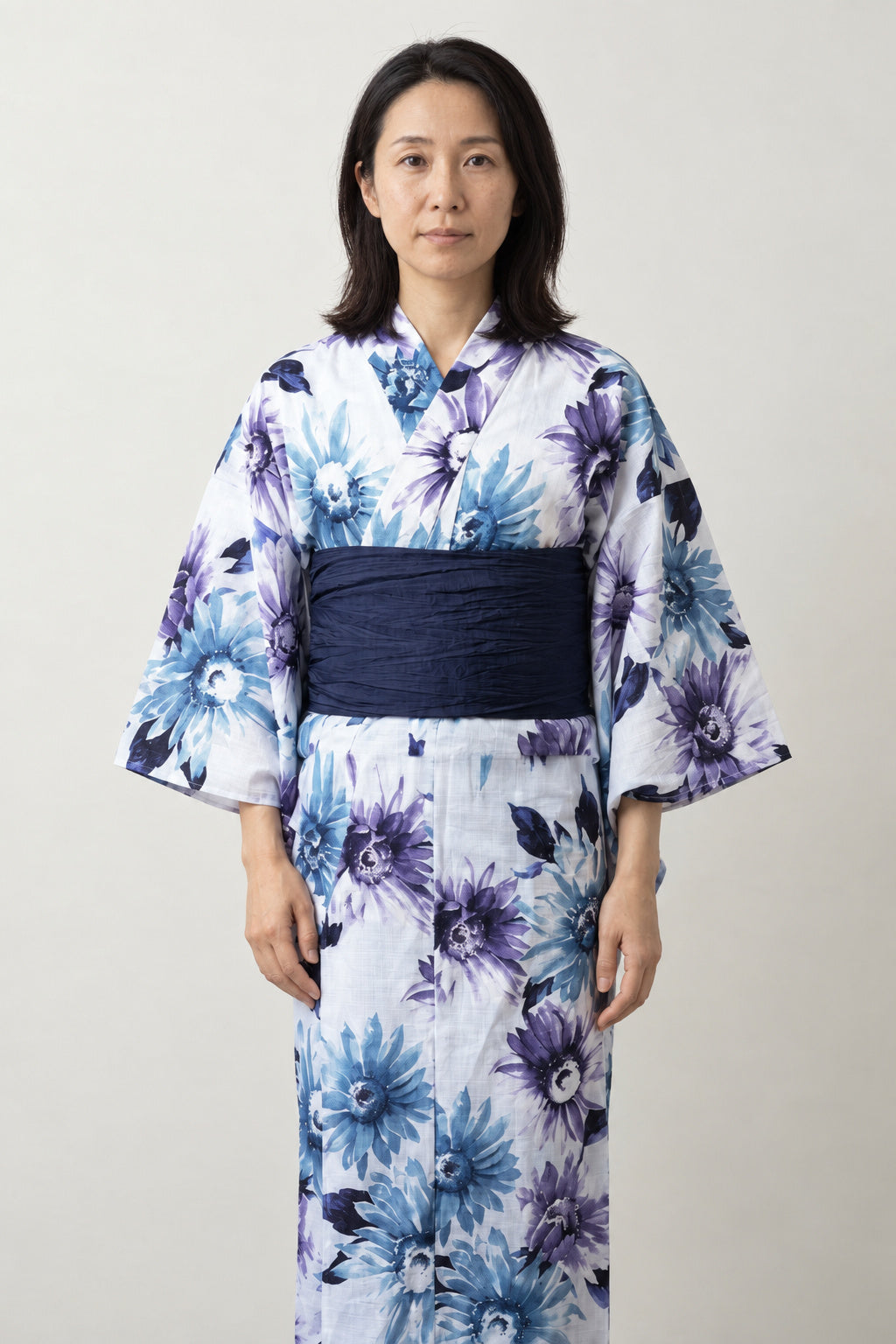 Violet Floral Kimono Dress 'Kikyo' – white women's kimono dress with violet and blue bellflower print and navy obi belt, traditional Japanese yukata, front view on model