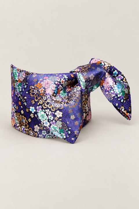 Violet Floral Obi Belt 'Murasakino' – violet purple brocade obi with pink, blue and white flowers, wide pre-tied brocade obi belt with sewn bow for women's kimono or yukata, studio view