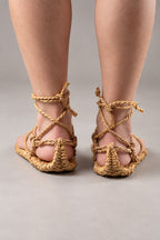 Waraji Sandals – waraji straw sandals with rope cords, worn barefoot, rear view on model