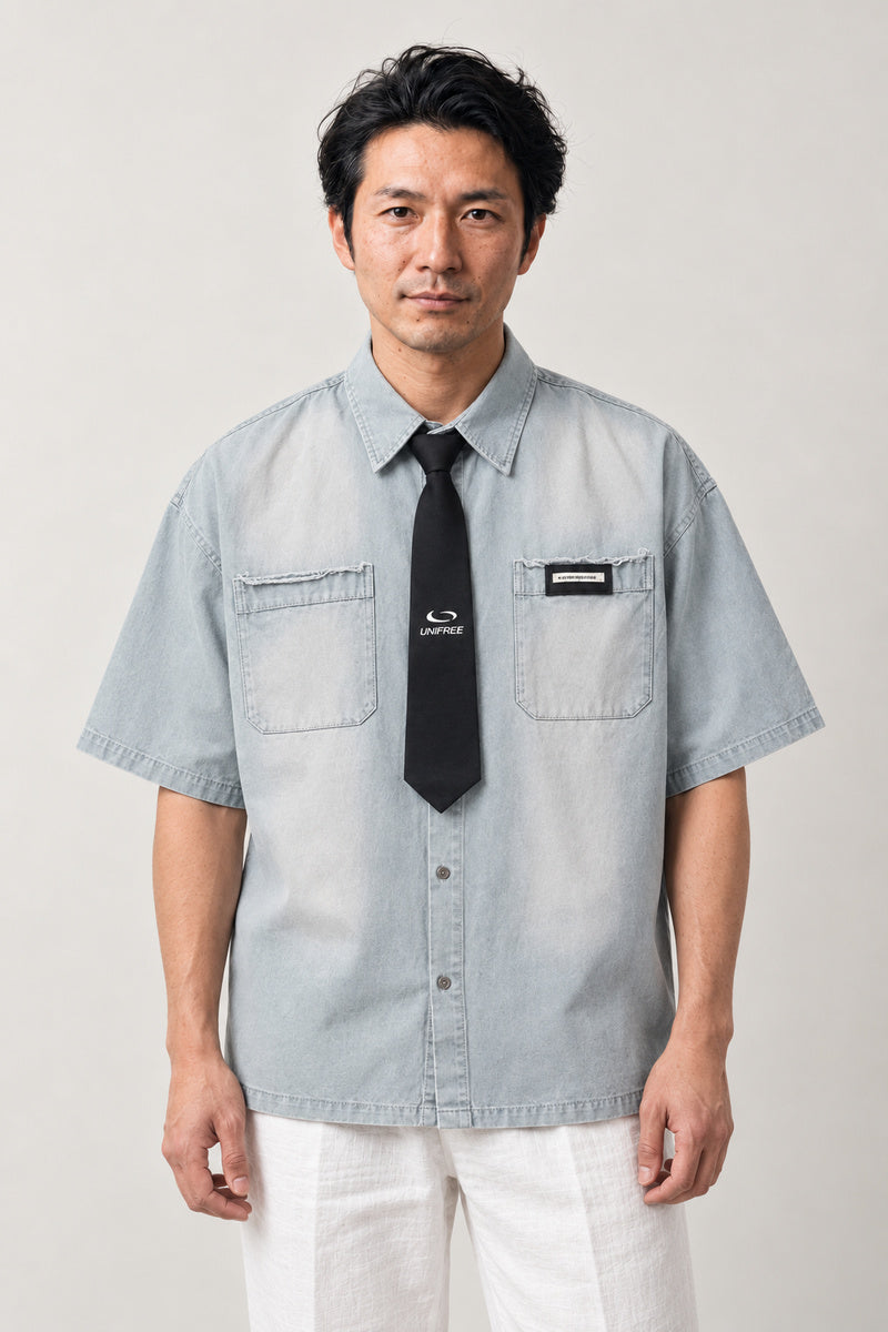 Washed Work Shirt and Tie Set 'Tsutome' – light blue washed short sleeve work shirt with black tie, Japanese streetwear uniform shirt, front view on model
