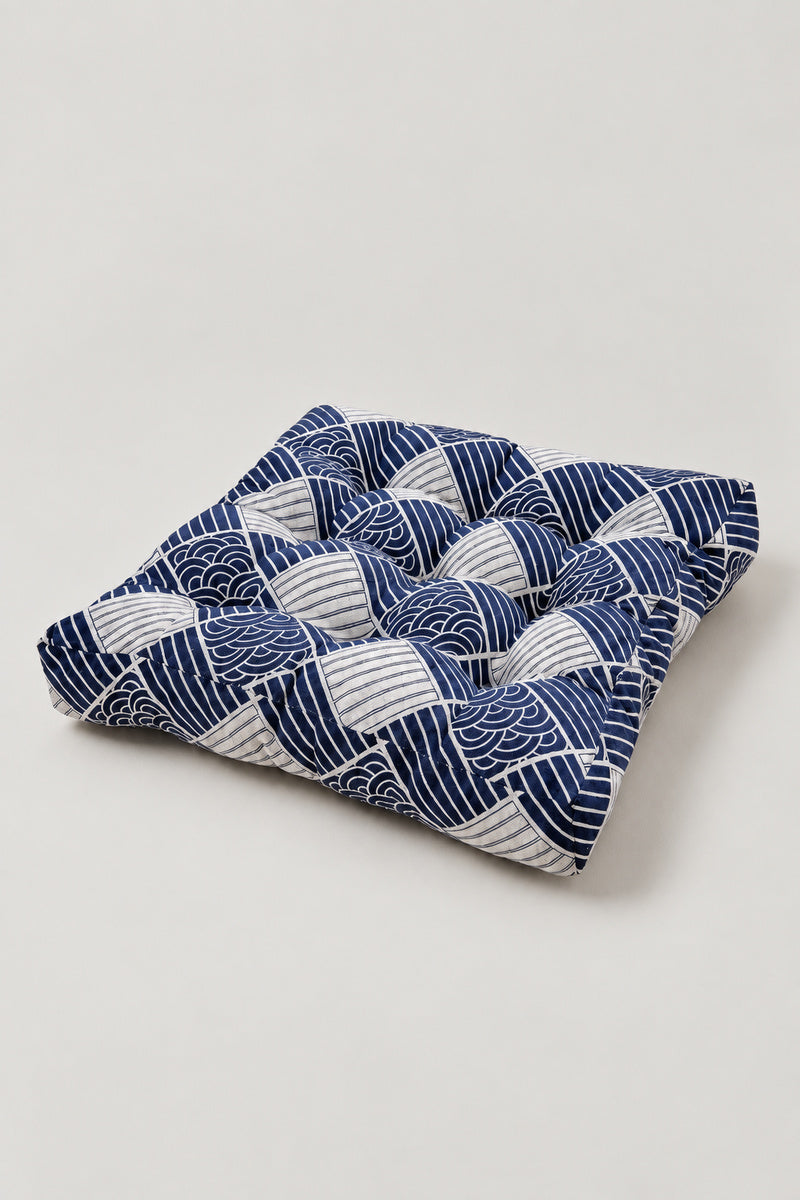 Wave Patchwork Chair Cushion 'Namiza' – square tufted chair cushion in a checkerboard patchwork of blue wave prints, Japanese seat pad, studio view