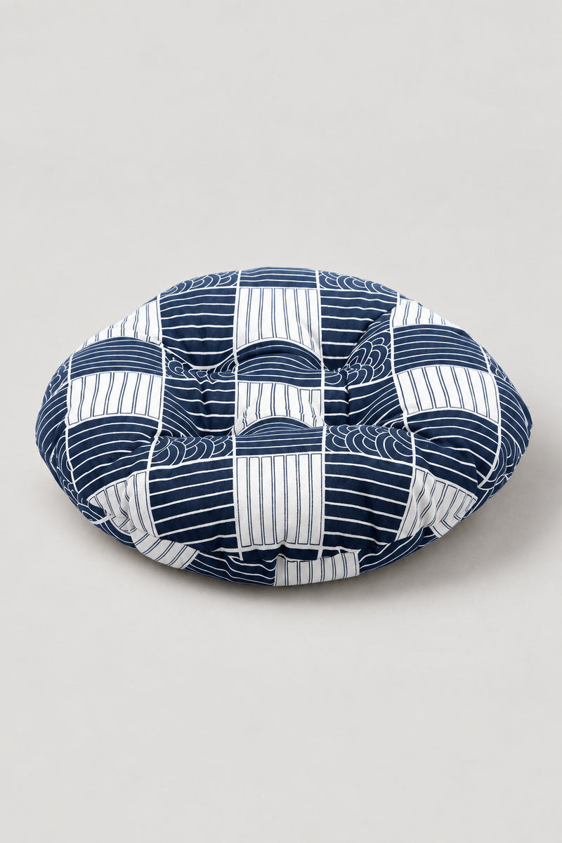 Wave Print Zabuton Floor Cushion 'Naminoza' – round floor cushion in a blue and white patchwork of stripes and scales, Japanese zabuton floor cushion, studio view