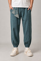 Wave Sash Harem Pants 'Namiobi' – teal wave sash harem pants, side view on model