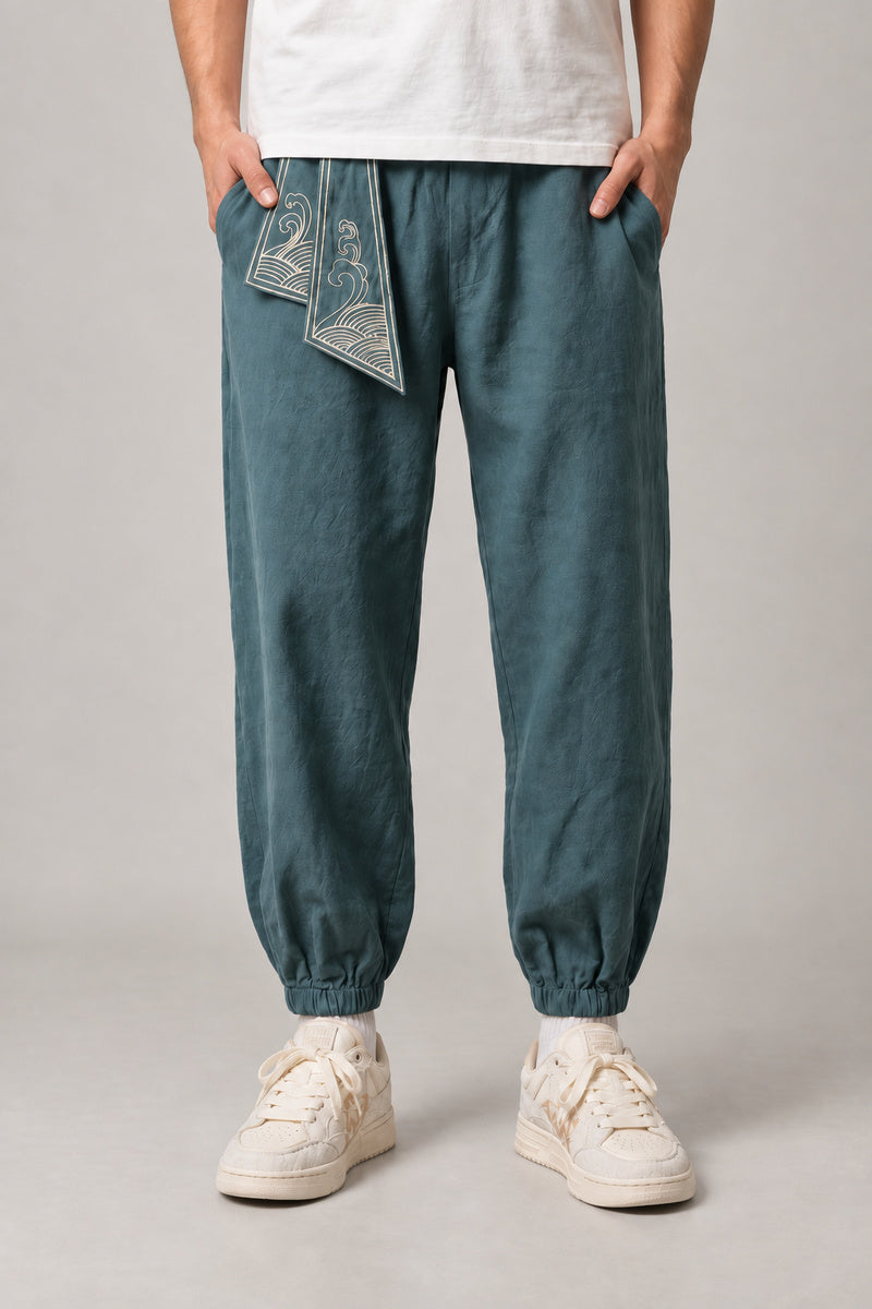 Wave Sash Harem Pants 'Namiobi' – teal wave sash harem pants, side view on model