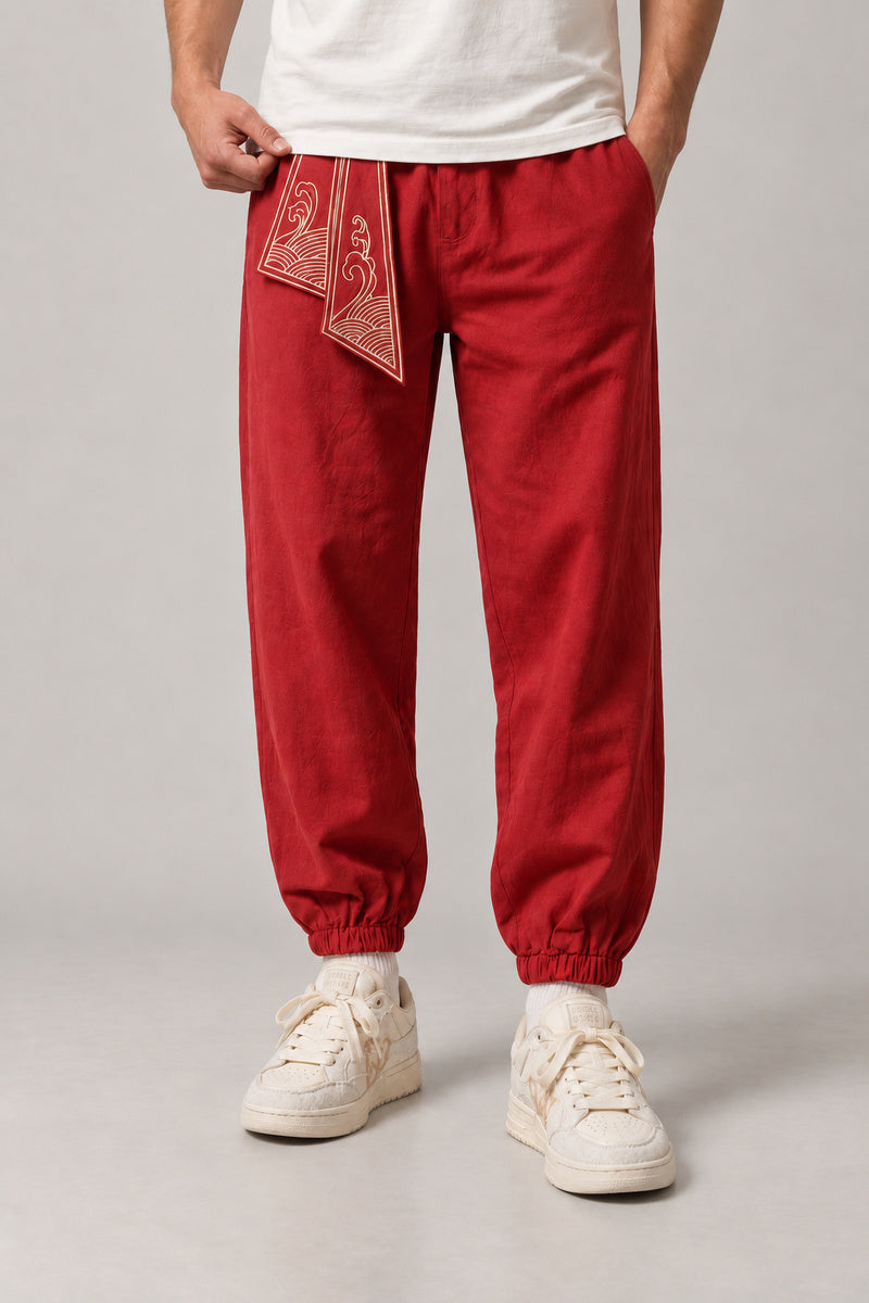 Wave Sash Harem Pants 'Namiobi' – red version of the wave sash harem pants, front view on model