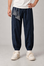 Wave Sash Harem Pants 'Namiobi' – navy version of the wave sash harem pants, front view on model
