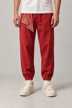 Wave Sash Harem Pants 'Namiobi' – red wave sash harem pants, front view on model