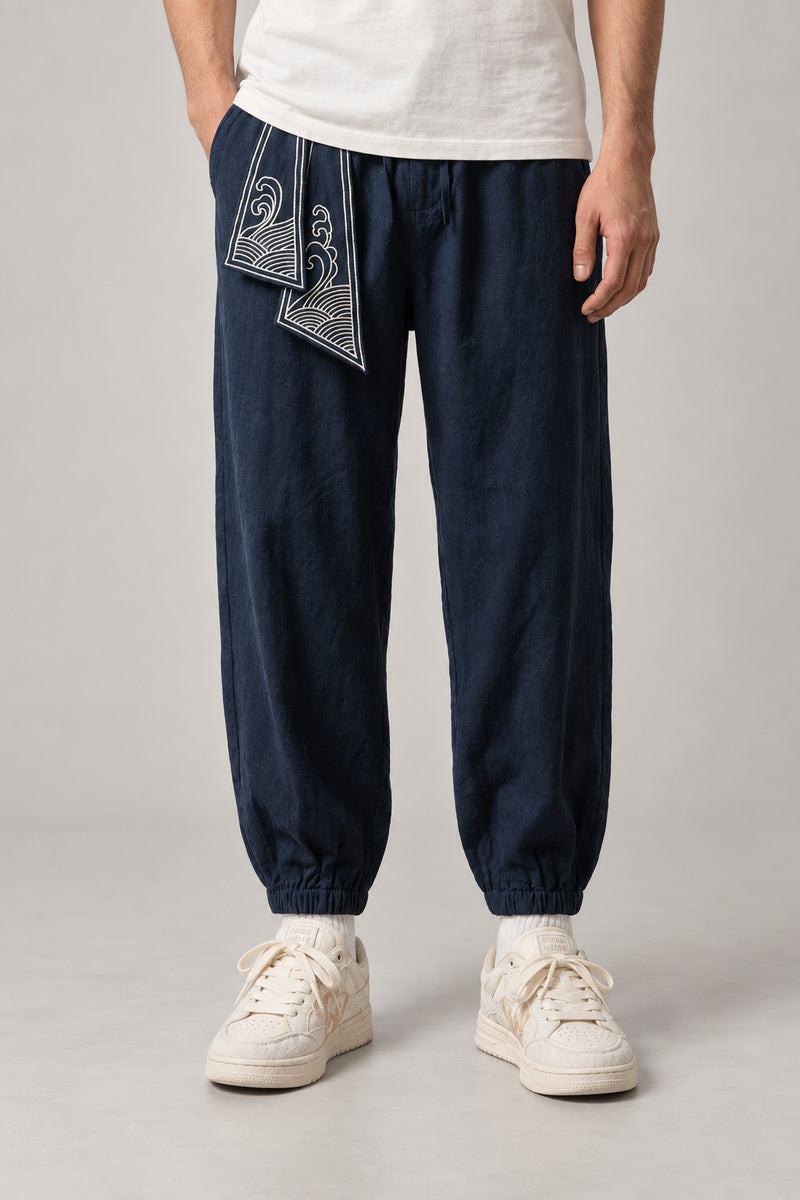 Wave Sash Harem Pants 'Namiobi' – navy wave sash harem pants, front view on model