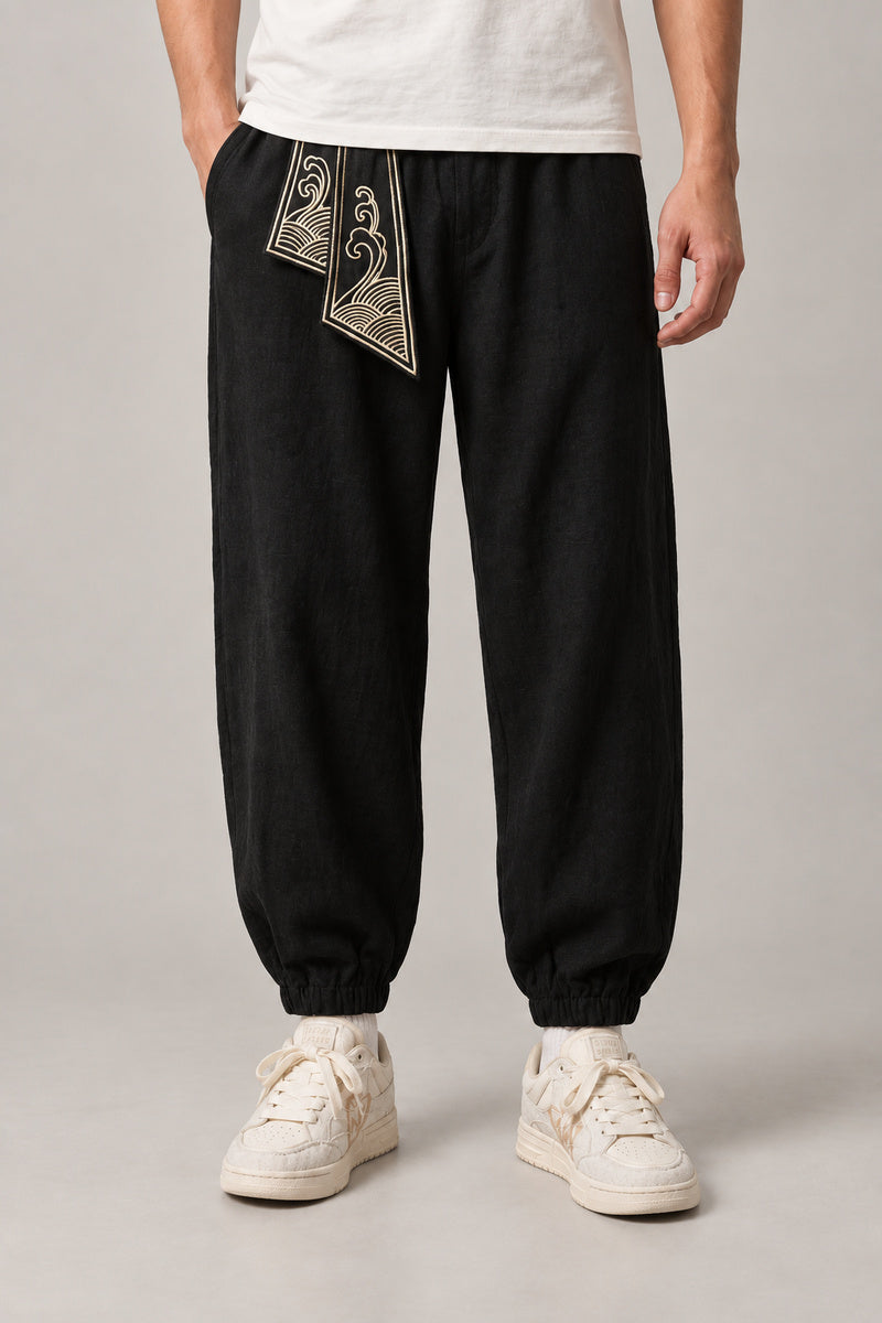Wave Sash Harem Pants 'Namiobi' – black wave sash harem pants, front view on model