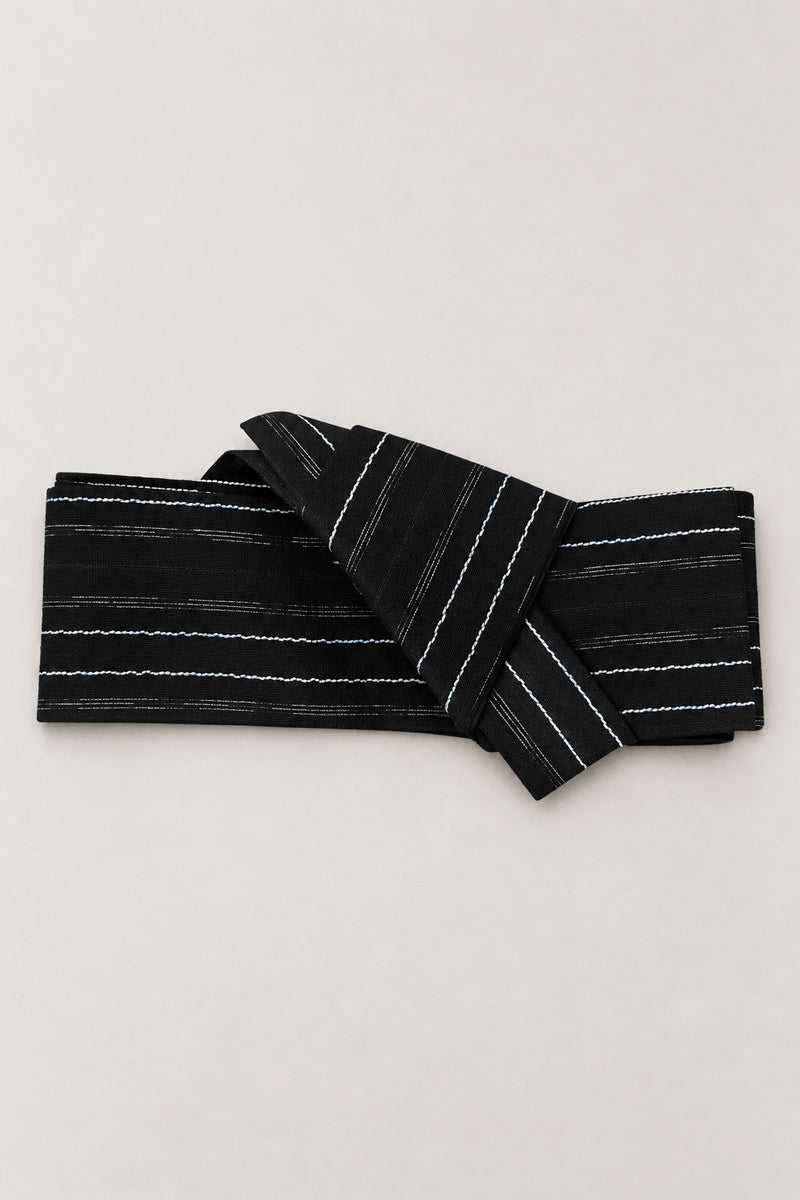 Wavy Stripe Obi Belt 'Namisuji' – black obi belt with wavy white stripes, narrow pre-tied Japanese obi belt with sewn knot and hidden adjustable closure, for kimono, yukata or jinbei, studio view