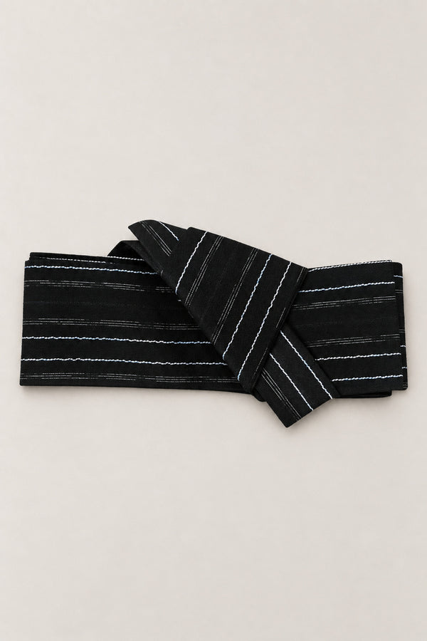 Wavy Stripe Obi Belt 'Namisuji' – black obi belt with wavy white stripes, narrow pre-tied Japanese obi belt with sewn knot and hidden adjustable closure, for kimono, yukata or jinbei, studio view