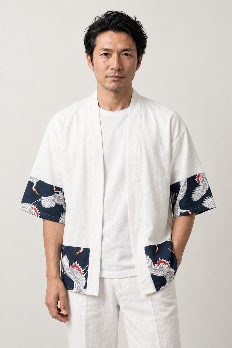 White Crane Border Kimono Cardigan 'Tancho' – white Japanese kimono cardigan with navy crane print border on hem and sleeves, unisex haori style, front view on model