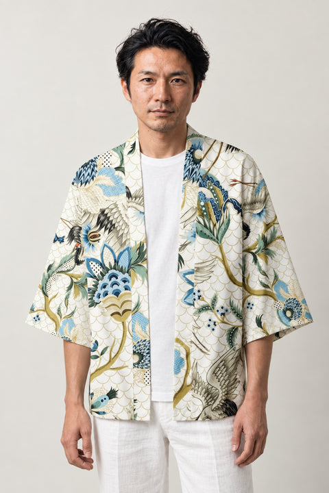 White Floral Haori Jacket 'Haruniwa' – white haori jacket with blue and green floral, crane and gold vine print, unisex Japanese kimono style cardigan, front view on model