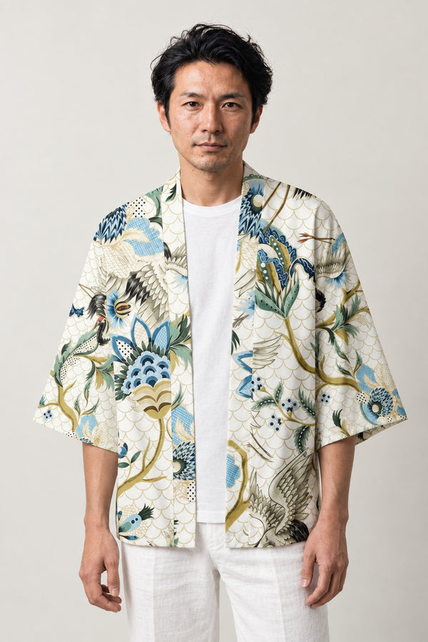White Floral Haori Jacket 'Haruniwa' – white haori jacket with blue and green floral, crane and gold vine print, unisex Japanese kimono style cardigan, front view on model